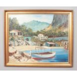 A large gilt frame Continental oil on board, cove scene with boat and huts. Signed Delin or