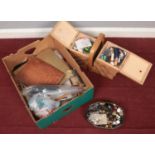 A box of sewing and knitting equipment. Includes needles, buttons, sewing box etc.