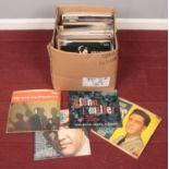 A box of LP records. Includes Elvis, Buddy Holly, Meat Loaf etc.