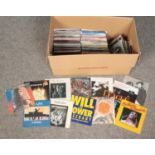 A box of 1970s and 1980s picture sleeve single records. Mostly disco.