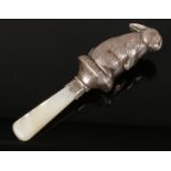 A silver baby's rattle by W H Collins & Co, modelled as a rabbit, with a Mother of Pearl Handle.