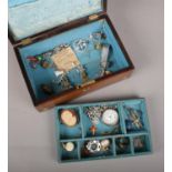 A rosewood work box with contents of jewellery. Includes silver albert chain and pocket watch,