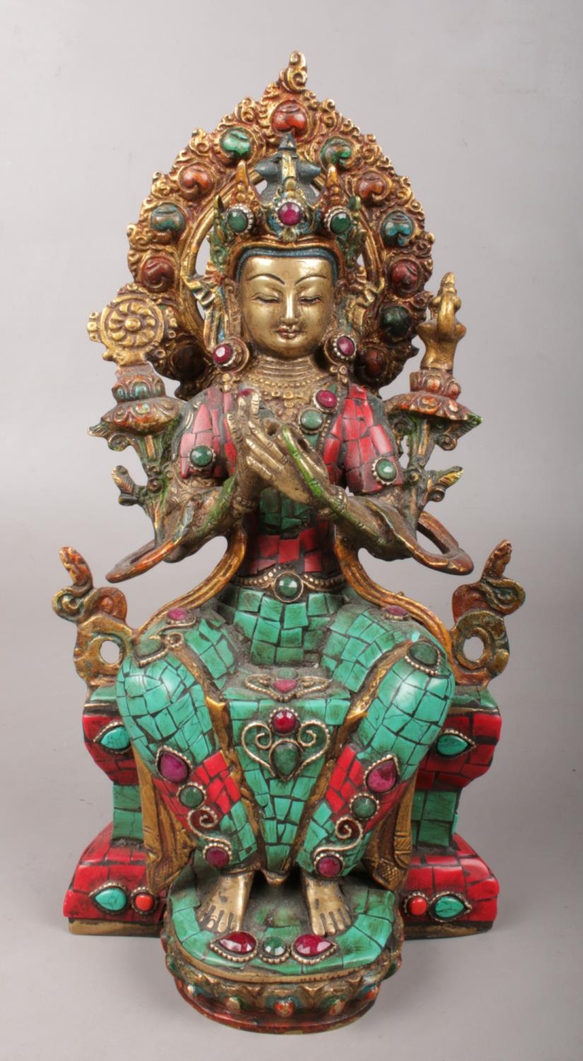 A bronze devotional figure with jewelled decoration. 28.5cm.