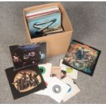 A box of LP and single records. Includes Nazareth, Elton John, Mike Oldfield etc.