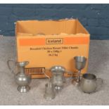 A group of pewter wares. Tankards, Goblets, water jug etc