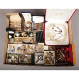 A large box of vintage costume jewellery. Includes Majorica pearls, coins, cufflinks, earrings etc.
