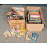 Two boxes of books. Includes annuals, Enid Blyton, Eagle comics etc.