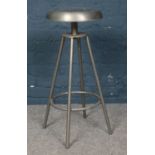 A metal swivel stool. H:74cm.