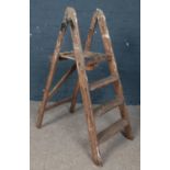 A small set of wooden step ladders.