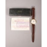 A vintage 'Smiths shockproof' gents wrist watch. To include the original receipt from 1965 and