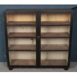 A Victorian painted and glazed bookcase.