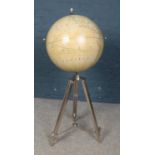 A decorative globe on stand. With chrome extending supports.