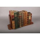 A Carved Wooden Book Stand, complete with Ten Books, from 1822-1906. Titles include 'The History