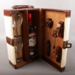 A wine carry case with contents. Includes full and sealed 1 litre bottle of Smirnoff vodka.
