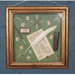 A gilt framed diorama. With contents of Richard Prescott & Co letter, writing instruments, stamps