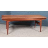 A 1960's Danish 'Trioh' teak and crossbanded metamorphic dining-to-coffee table. Full extended: L: