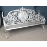 A large painted cast iron bench. Height 107.5cm, Width 183cm, Depth 64cm.