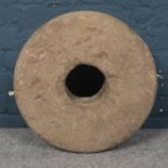 A Stone Mill Wheel. Diameter - 47cm Depth - 15cm