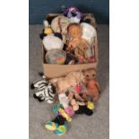 A box of mostly soft toys. Including Disney, doll in wooden crib, ET, etc.