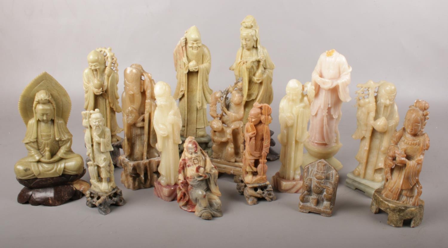 A good collection of Chinese carved soapstone figures. Some with damage.