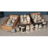 Three boxes of 20th Century German ceramic stein drinking glasses. To include some lidded and