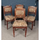 A set of four mahogany dining chairs. With upholstered seats and back rests.