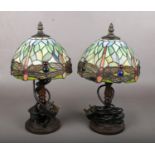 A pair of small Tiffany style table lamps with dragonfly shades.