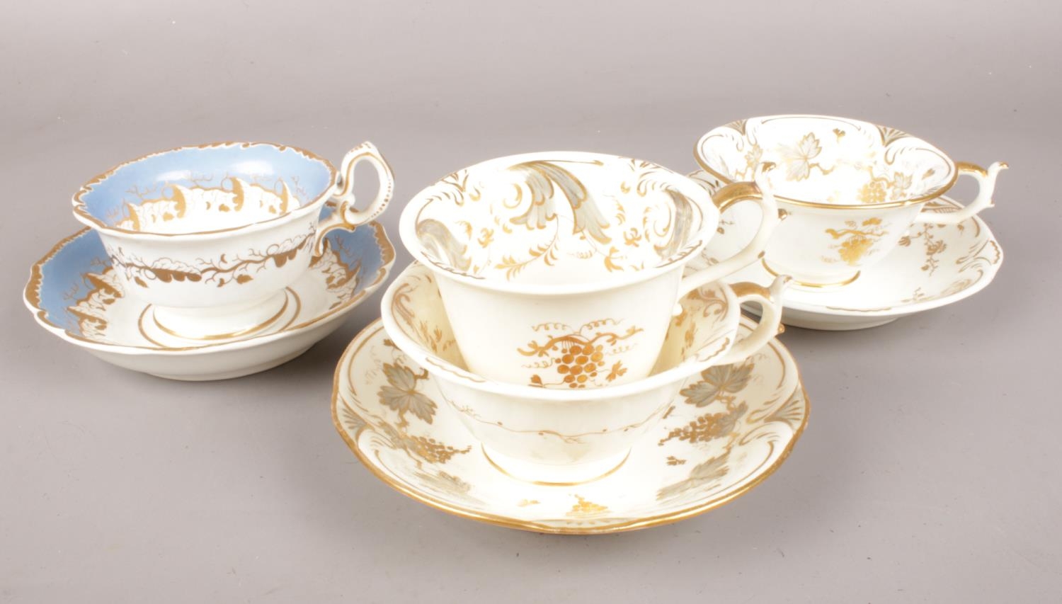 A collection of Rockingham pottery. Trio & 2 cups and saucers c.1830-42