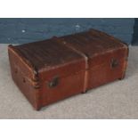 A vintage wood bound travel trunk.