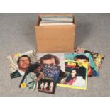 A box of LP records. Includes Elvis, The Searchers, The Seekers etc.