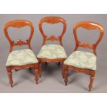 Three Victorian Mahogany balloon backed chairs with upholstered seats. H: 87cm, W:44cm. Condition