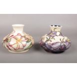 Two Moorcroft squat vases. (marks to bases) 12.5cm h.