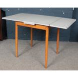 A vintage dining table with Formica top.