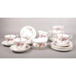 A Royal Albert 'Lavender Rose' tea set. tea cups, saucers, tea plates, Milk jug, sugar bowl.
