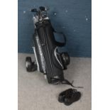 A Dunlop golf carry bag and trolley with collection of unused Dunlop Titanium Matrix clubs, umbrella
