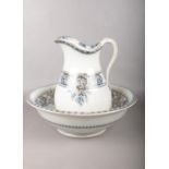 A ceramic decorative wash bowl and jug. 30cm