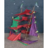 A kite formed as a sail boat.
