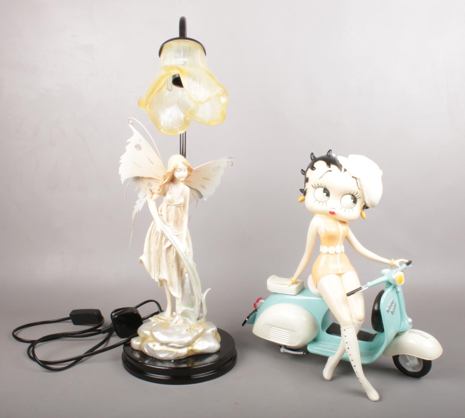 A boxed limited edition of Betty Boo on a scooter, together with a fairy figured lamp. Betty Boo: