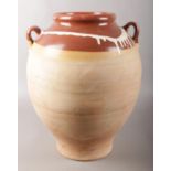 A terracotta twin handled olive oil vessel. 41cm.