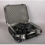 A large pair of Opticron 11x80 field binoculars. In hard carry case.