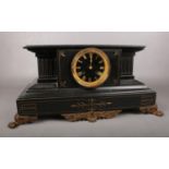 A 19th Century black slate mantle clock. Comprising of a classical architectural case applied with