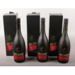 Three boxed bottles of full & sealed Remy Martin cognac.