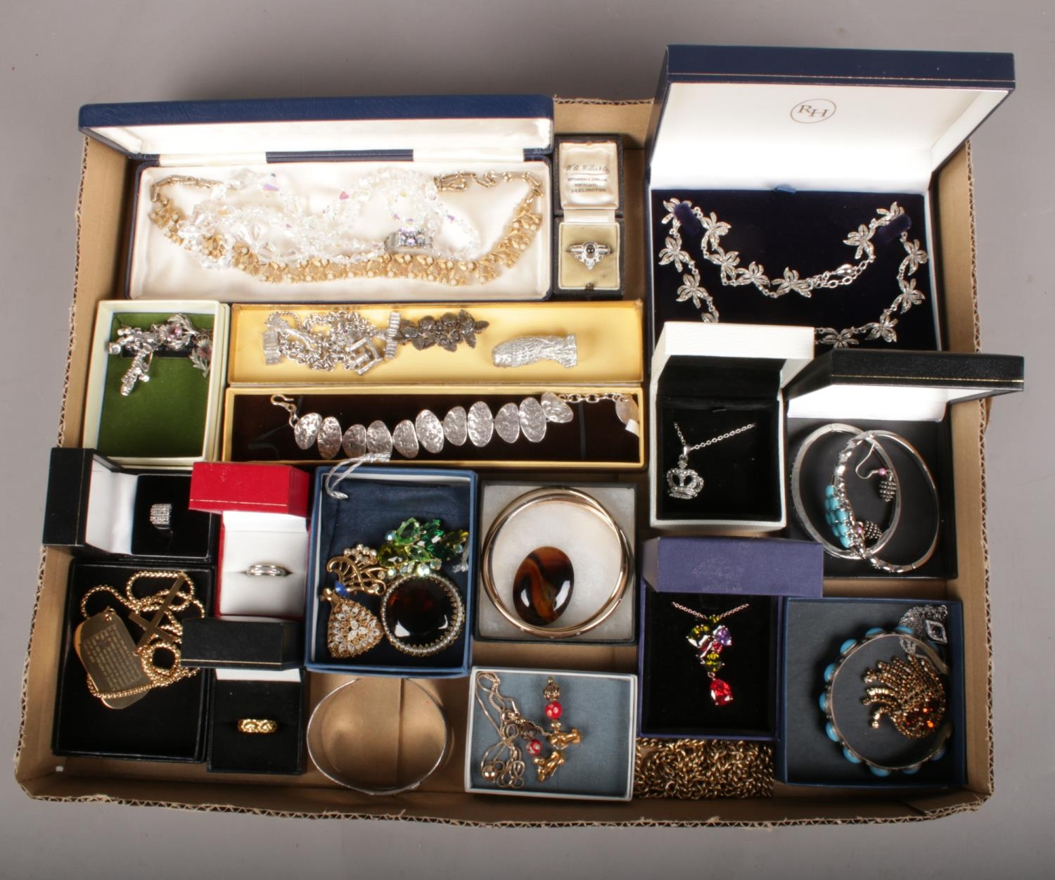 A box of costume jewellery. Includes vintage examples, bangles, necklaces etc.