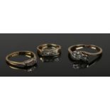 Three gold and diamond rings. Includes 18ct gold platinum and three stone diamond example. 4.76g.