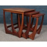 A G-Plan Astro style nest of three tables in teak. H: 51cm, W: 50.5cm, D: 50cm. Condition good.