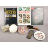 A box of collectables. Including vintage mobile phone, bird books, tin, etc.