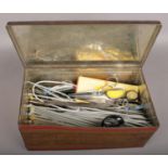 A Collection of Sewing and Knitting equipment with storage tin. Size of Tin: W = 36cm, D = 20cm, H =