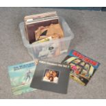 A box of LP and single records. Includes Elvis Presley, Abba, The Beach Boys etc.
