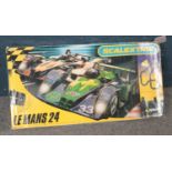 A boxed Scalextric Le Mans 24, including track and cars.