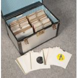 A metal carry case of single records. Includes Alice Cooper, Phil Collins, Small Faces etc.